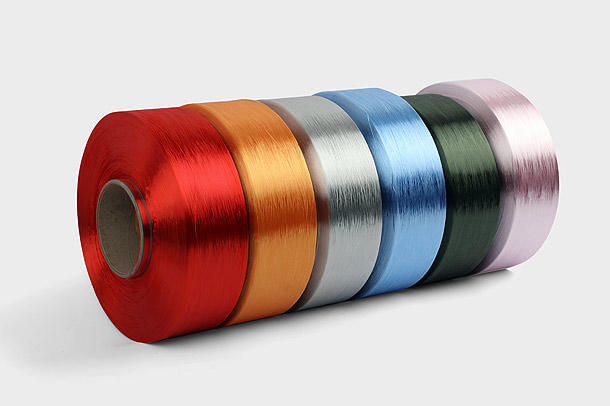 Polyester Dope-dyed Yarn is a type of textile fibre that is produced from the chemical polymerization of ethylene and a colourant