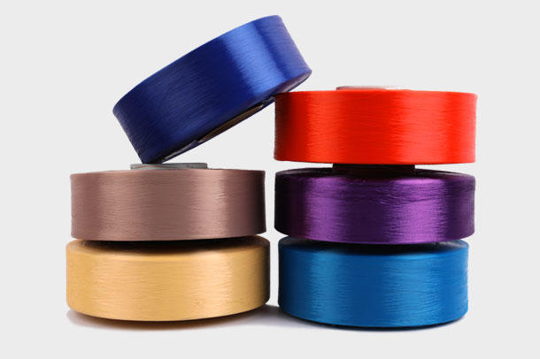 Why can polyester colored DTY be widely used in the apparel industry?
